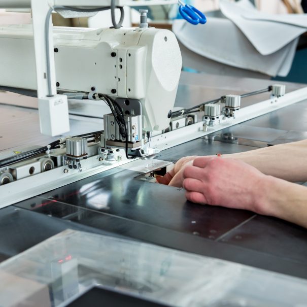 Fabric industry production line. Textile factory. Working tailoring process cloth. Modern equipment